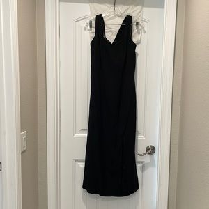 Long, ankle length black dress. Good condition. Cross cross back.